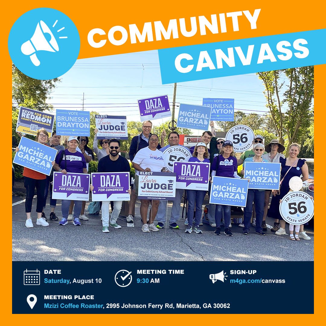 Community canvass event picture with volunteers from a previous canvass posing and holding campaign signs